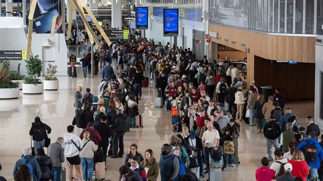 Passengers waiting in security line at Miami Airport