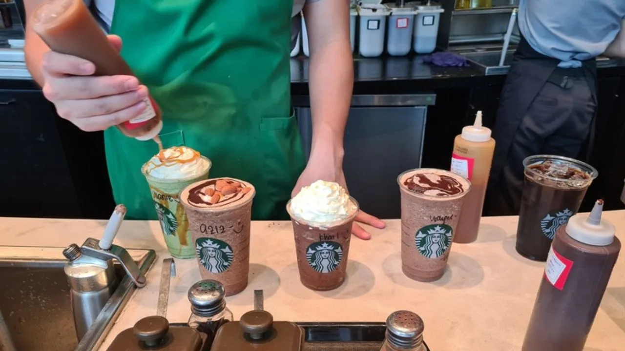 Travelers enjoying coffee at Starbucks Miami Airport